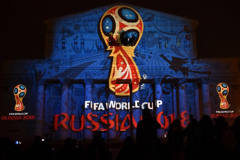 Facade of historical Bolshoi Theatre illuminated with official emblem of 2018 FIFA World Cup