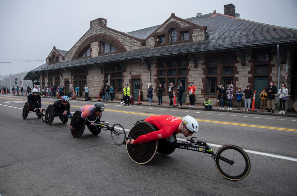 Jetze Plat leads fellow wheelchair racers during the 127th running of the Boston Marathon on Waverly Street in Framingham, April 17, 2023. 