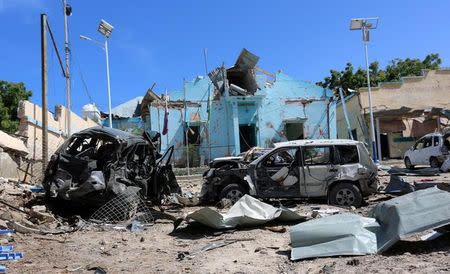 A view shows the destruction and wreckages of cars after an attack on a government building in Mogadishu, Somalia June 20, 2017. REUTERS/Stringer