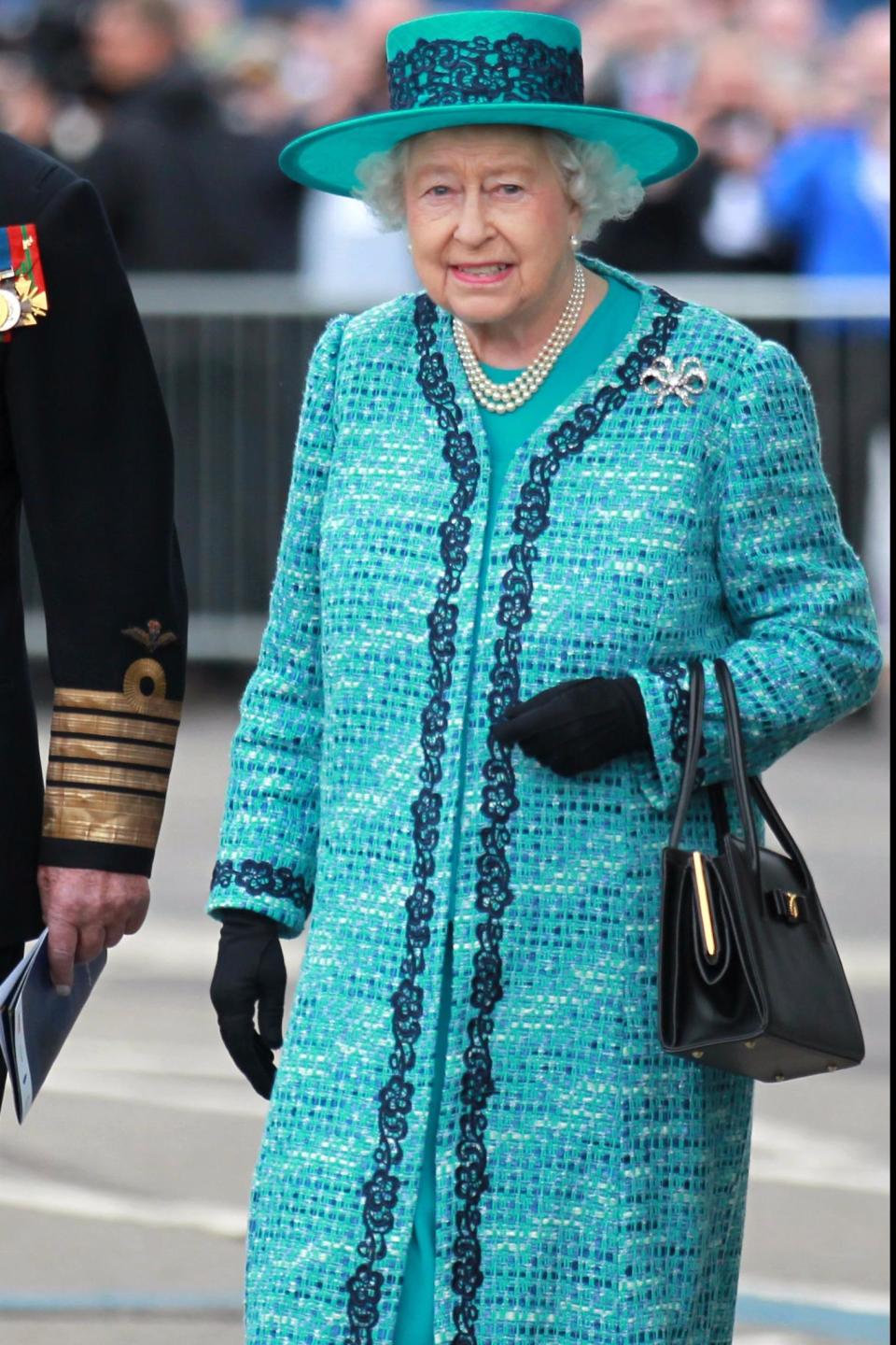 Her majesty rugged up in this colourful coat with a contrasting trim in 2014.