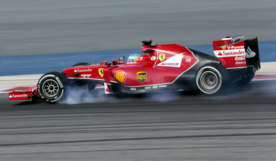 Formula One driver Fernando Alonso of Ferrari speeds down the track during pre-season testing at the Bahrain International Circuit in Sakhir, Bahrain, on Friday, Feb. 28, 2014. (AP Photo/Hasan Jamali)