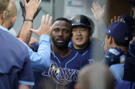 Tampa Bay Rays' Randy Arozarena, center left, is greeted in the dugout after he hit a two-run home run that also scored Ji-Man Choi, center right, during the fourth inning of a baseball game against the Seattle Mariners, Thursday, June 17, 2021, in Seattle. (AP Photo/Ted S. Warren)