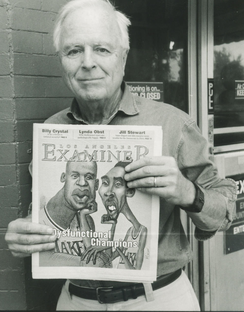 Richard Riordan with a prototype of The Los Angeles Examiner in 2003 (Getty Images)