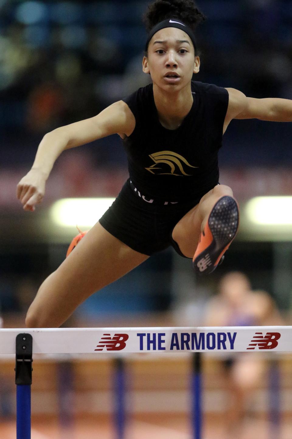 Fiona Carter, of Paramus Catholic, competes in the high hurdle shuttle relays. Wednesday, January 22, 2020