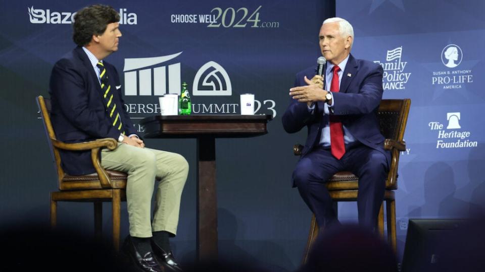 Former Vice President Mike Pence fields questions Friday from Tucker Carlson in Des Moines, Iowa. (Getty Images)