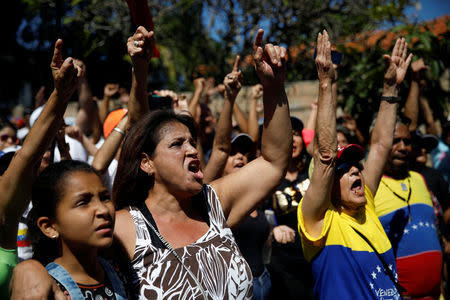 Opposition supporters shout slogans during a gathering with members of Venezuela's National Assembly in La Guaira, Venezuela January 13, 2019. REUTERS/Carlos Garcia Rawlins