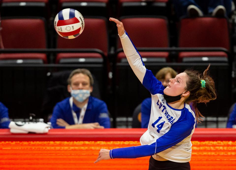 Lutheran's Makenna Cox (14) sends a spike over the net against Augusta Southeastern during the semifinals of the IHSA Class 1A State Final Tournament at Redbird Arena in Normal, Ill., Friday, November 12, 2021. [Justin L. Fowler/The State Journal-Register] 