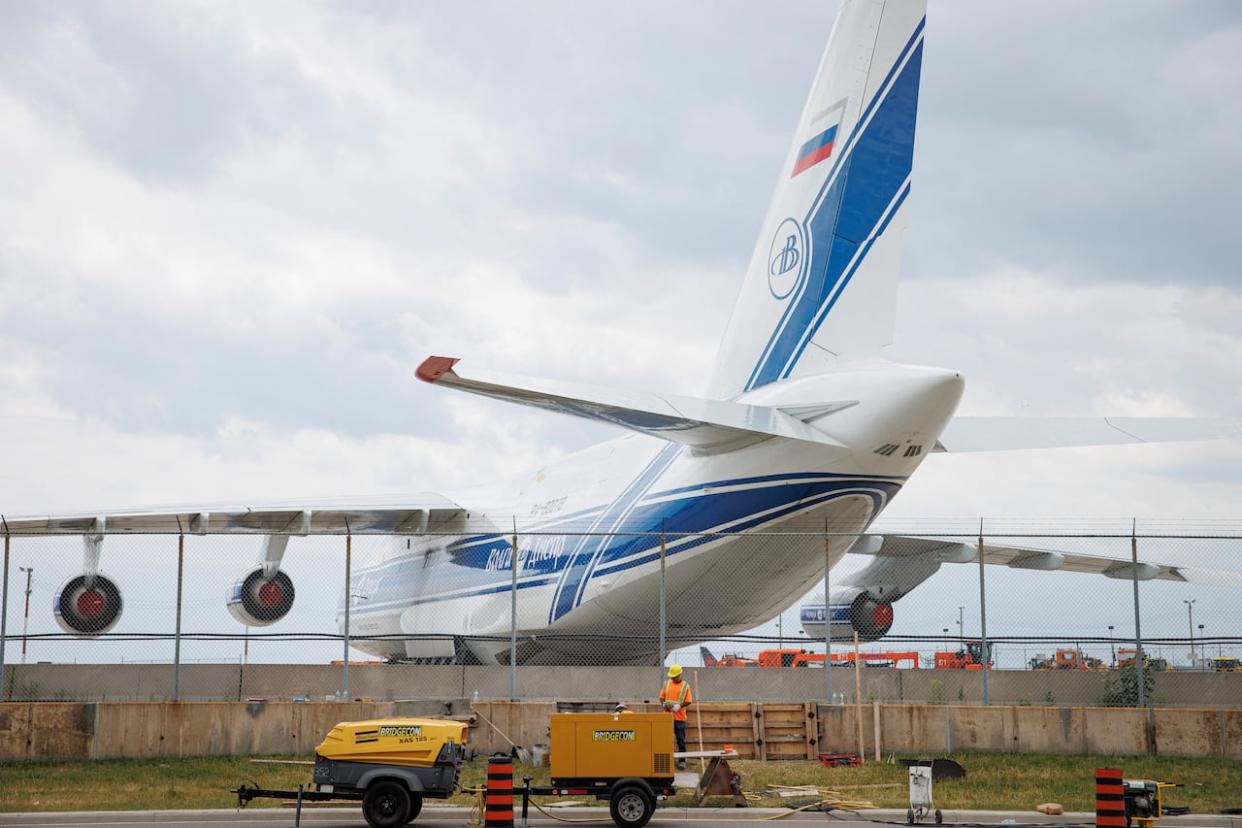 An Antonov-124 cargo plane owned by Volga Dnepr sits idle on the tarmac at Pearson airport in Toronto on June 13. (Evan Mitsui/CBC - image credit)