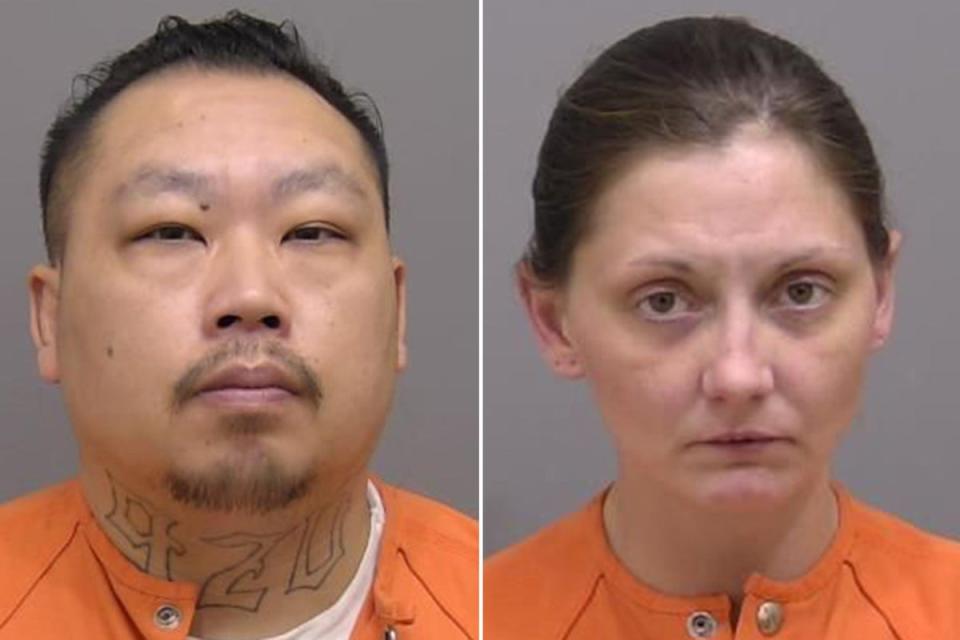 Jesse Vang, left, and Katrina Baur, right, have been charged with child neglect in connection to the disappearance of Ms Baur’s 3-year-old son, Elijah Vue (Manitowoc County Sheriff’s Office)