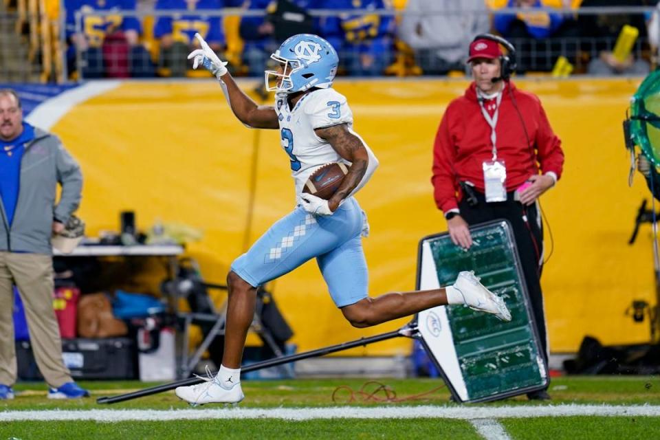 North Carolina wide receiver Antoine Green celebrates as he runs to the end zone for a touchdown after making a catch during the first half of an NCAA college football game against Pittsburgh on Thursday, Nov. 11, 2021, in Pittsburgh. (AP Photo/Keith Srakocic)