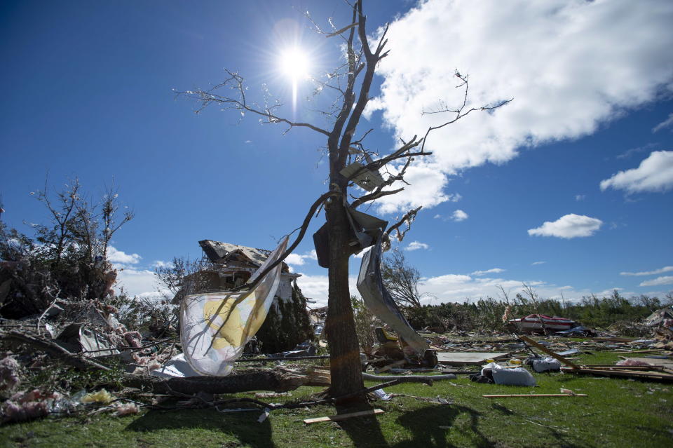 <p>A child’s blanket and building materials are tangled in a tree in a neighbourhood destroyed by a tornado in Dunrobin, Ont., west of Ottawa, on Saturday, Sept. 22, 2018. The storm tore roofs off of homes, overturned cars and felled power lines in the Ottawa community of Dunrobin and in Gatineau, Que. (Photo from Justin Tang/The Canadian Press) </p>