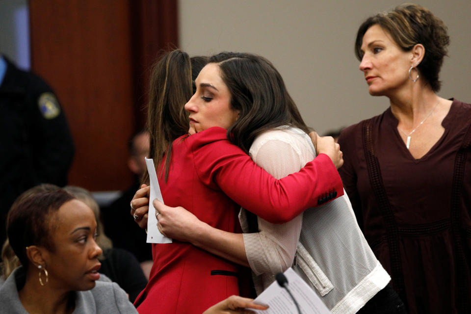 Aly Raisman, left, embraces Jordyn Wieber during the sentencing hearing for Larry Nassar.&nbsp; (Photo: Brendan McDermid / Reuters)