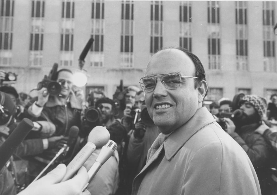 FILE - John D. Ehrlichman, a key figure in the Watergate scandal, is surrounded by reporters outside the U.S. District Court in Washington, Feb. 22, 1975. Ehrlichman was convicted of conspiracy and perjury and served 18 months in prison. (AP Photo, File)