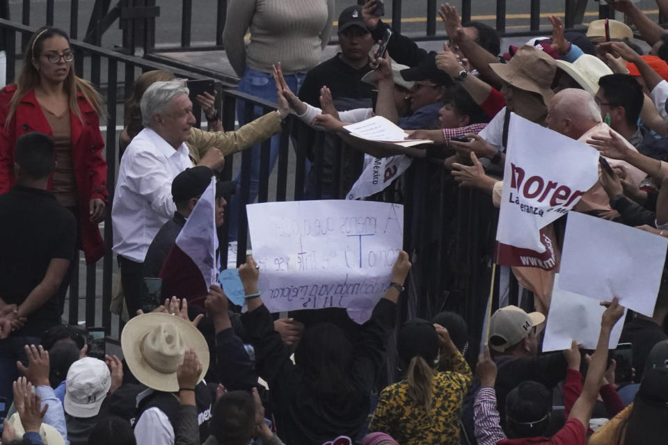 Mexican President Andres Manuel Lopez Obrador saya farewell after a march to the capital's main square, the Zócalo, where thousands met to show their support for his government, in Mexico City, Sunday, November 27, 2022. (AP Photo / Marco Ugarte)