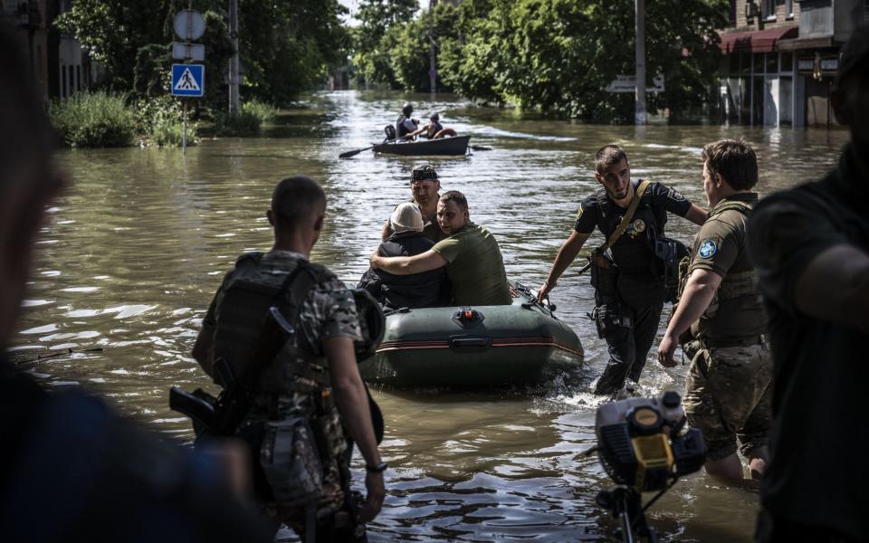 People being evacuated from flooded areas after the explosion at the Kakhovka hydropower plant - Anadolu Agency/Anadolu