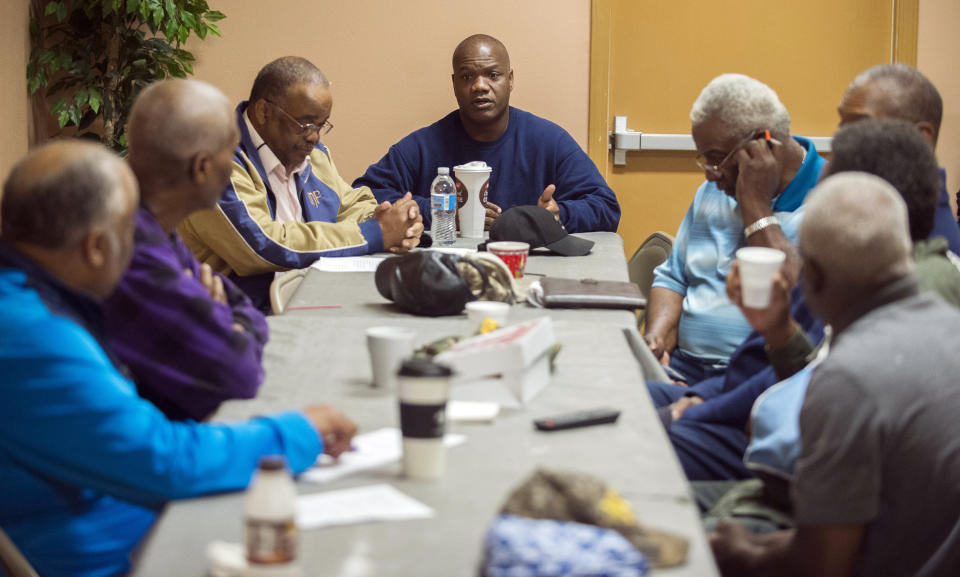 Rev. Kyle Sylvester, center, who pastor's St. Mary Missionary Baptist Church which was the first church that went ablaze, speaks with other area pastors Thursday, April 4, 2019, at First Benjamin Baptist Church in Opelousas, La. Authorities in southern Louisiana are investigating a string of "suspicious" fires at three African American churches in recent days. Fire Marshal H. "Butch" Browning said it wasn't clear whether the fires in St. Landry Parish are connected and he declined to get into specifics of what the investigation had yielded so far but described the blazes as "suspicious." (Leslie Westbrook/The Advocate via AP)