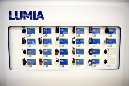 Nokia's Asha mobile phones are seen in a Helsinki mobile phone store January 21, 2014. REUTERS/Antti Aimo-Koivisto/Lehtikuva/Files