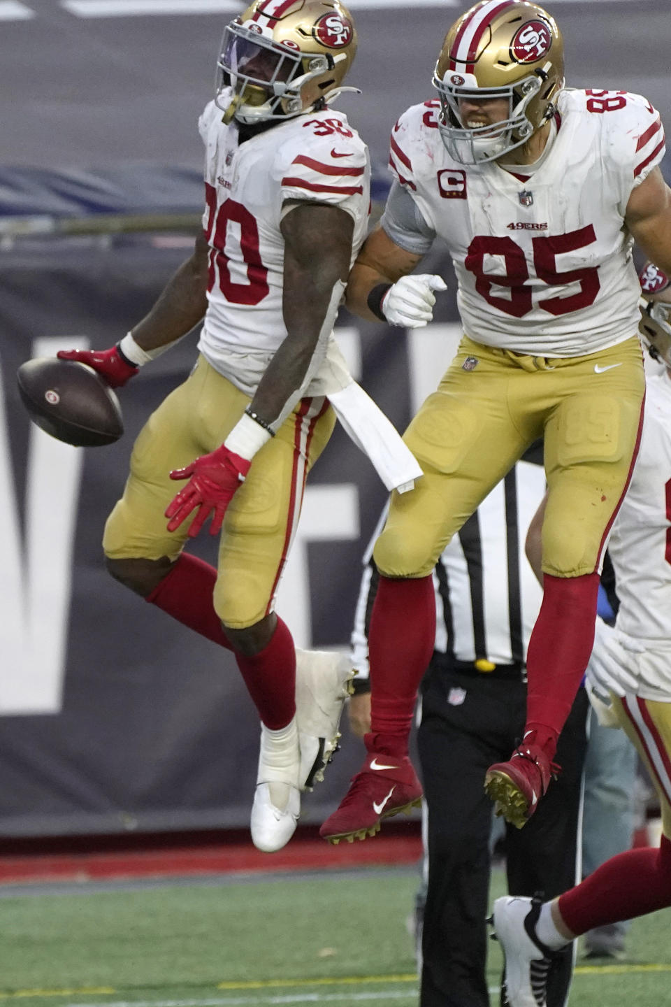 San Francisco 49ers running back Jeff Wilson Jr., left, celebrates his touchdown with George Kittle, right, in the first half of an NFL football game against the New England Patriots, Sunday, Oct. 25, 2020, in Foxborough, Mass. (AP Photo/Steven Senne)