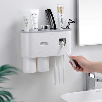 Save space and effort with this automatic toothpaste dispenser and bathroom wall organiser