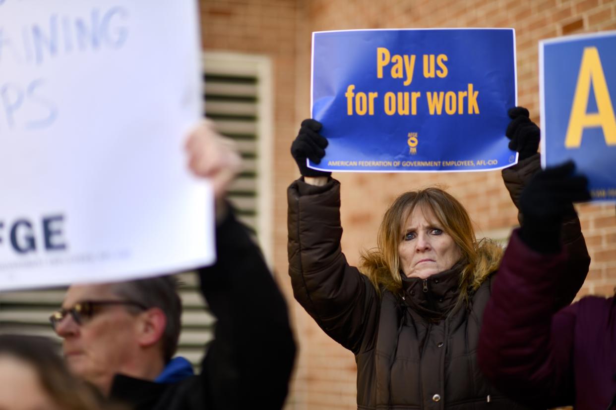 PHILADELPHIA, PA - JANUARY 25:  Elizabeth Hughes holds a placard stating 