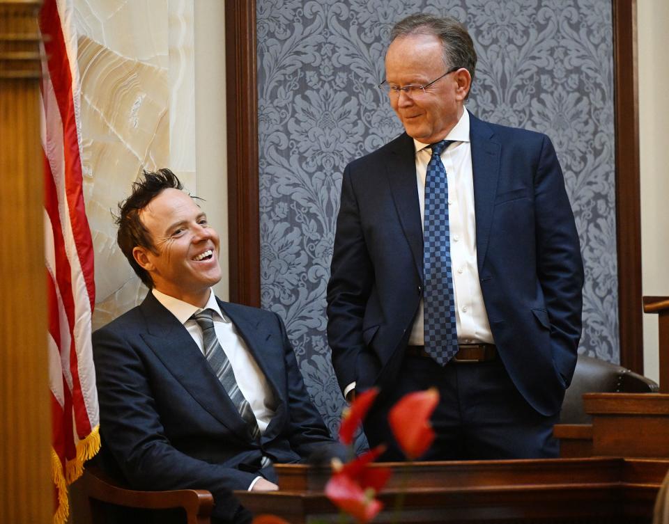 Utah Jazz owner Ryan Smith talks with Senate President Stuart Adams.