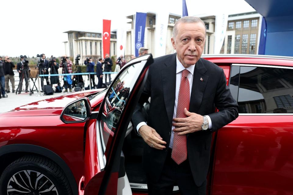 Erdoğan stands next to his Togg T10X, Turkey’s first domestically produced electric car. <a href="https://www.gettyimages.com/detail/news-photo/turkeys-president-recep-tayyip-erdogan-stands-next-to-his-news-photo/1250748150?adppopup=true" rel="nofollow noopener" target="_blank" data-ylk="slk:Adem Altan/AFP via Getty Images;elm:context_link;itc:0;sec:content-canvas" class="link ">Adem Altan/AFP via Getty Images</a>