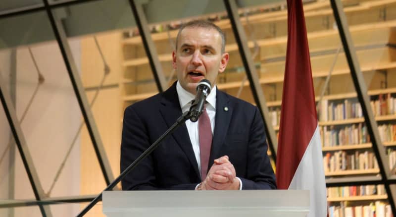 Icelandic President Guoni Johannesson speaks during the Latvia's 100th state anniversary at the Latvian National Library. Alexander Welscher/dpa