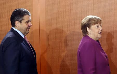 German Foreign Minister Sigmar Gabriel and Chancellor Angela Merkel attend the weekly cabinet meeting at the Chancellery in Berlin, Germany, March 7, 2018. REUTERS/Fabrizio Bensch