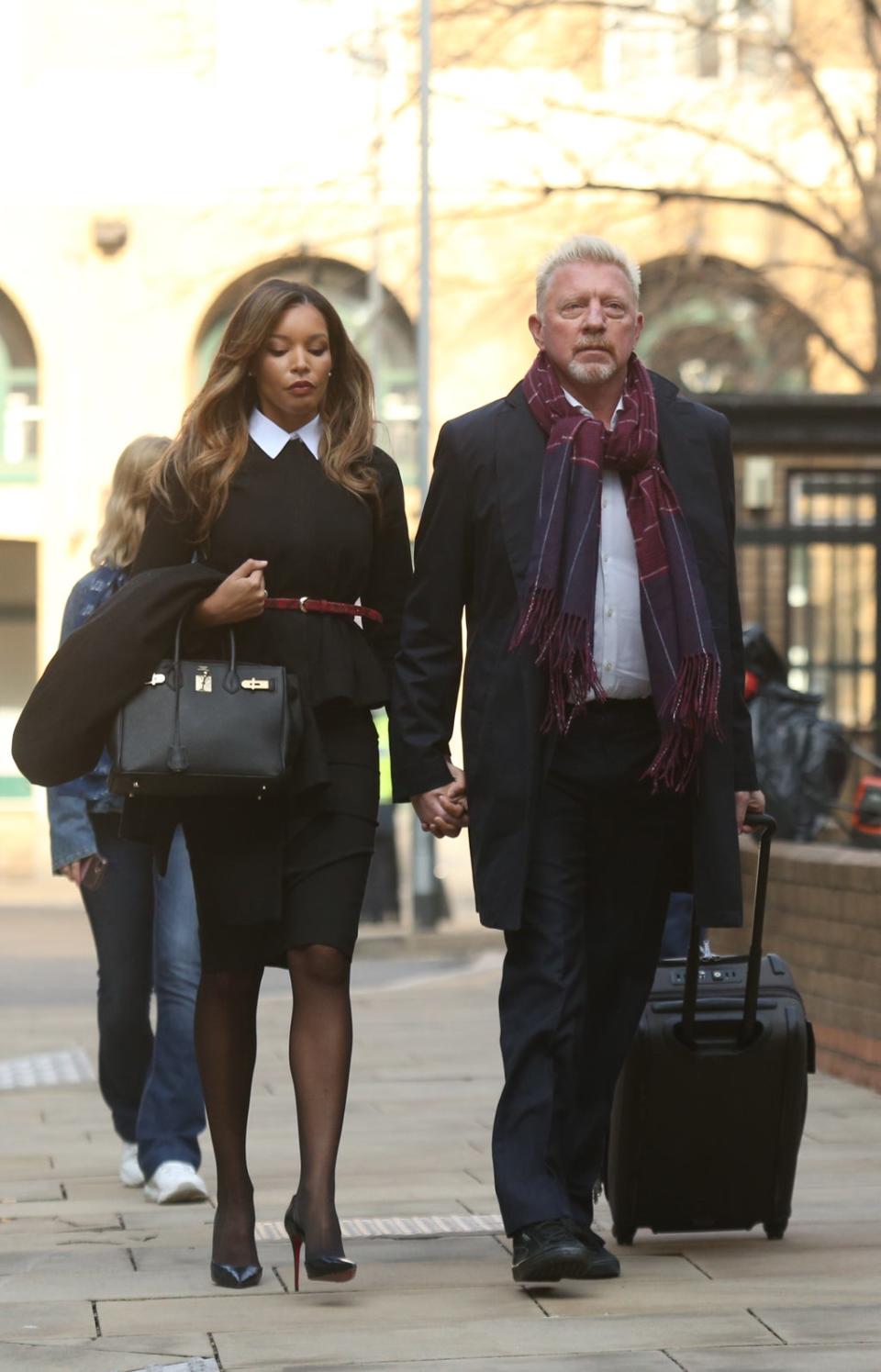 Becker was accompanied by girlfriend Lilian de Carvalho Monteiro on his way to court (PA Wire)