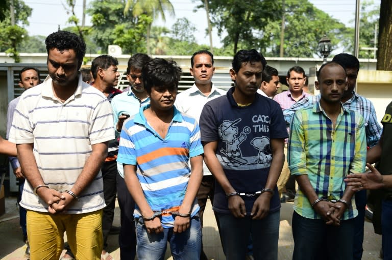 Bangladesh police escort (from L) Minhajul Abedin Russel, Shakhawat Hossain, Russel Chowdhury and Tamjid Ahmed Rubel, after they were arrested over the murder of Italian citizen Cesare Tavella, in Dhaka, in October 2015