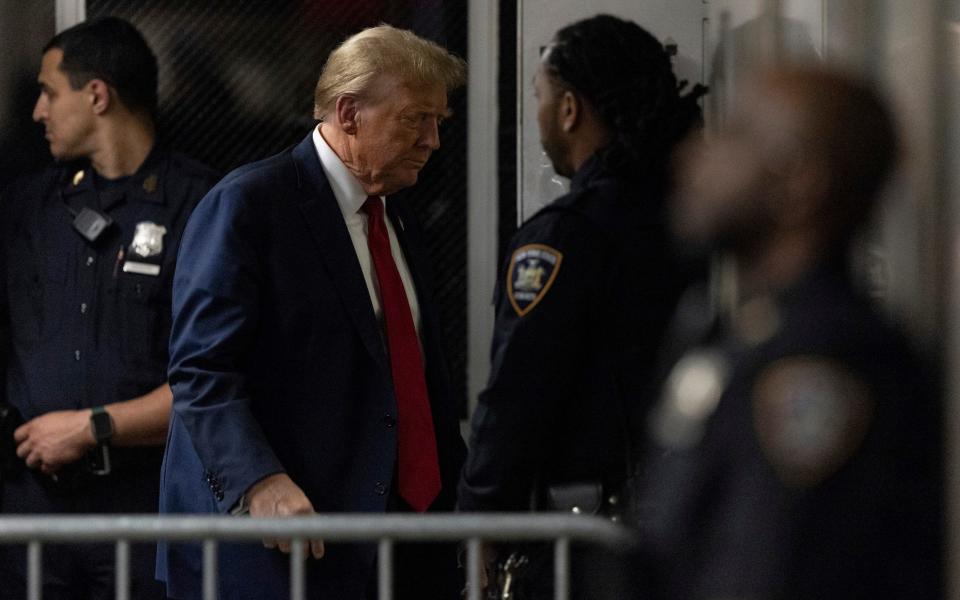 Donald Trump returns from a break from his trial at Manhattan criminal court