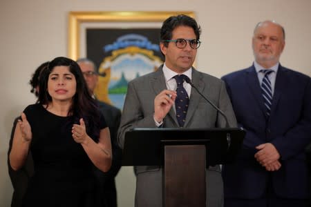 Costa Rica's Education Minister Edgar Mora speaks to the media after resigning for protests over his "progressive" ideas at the presidential house in San Jose