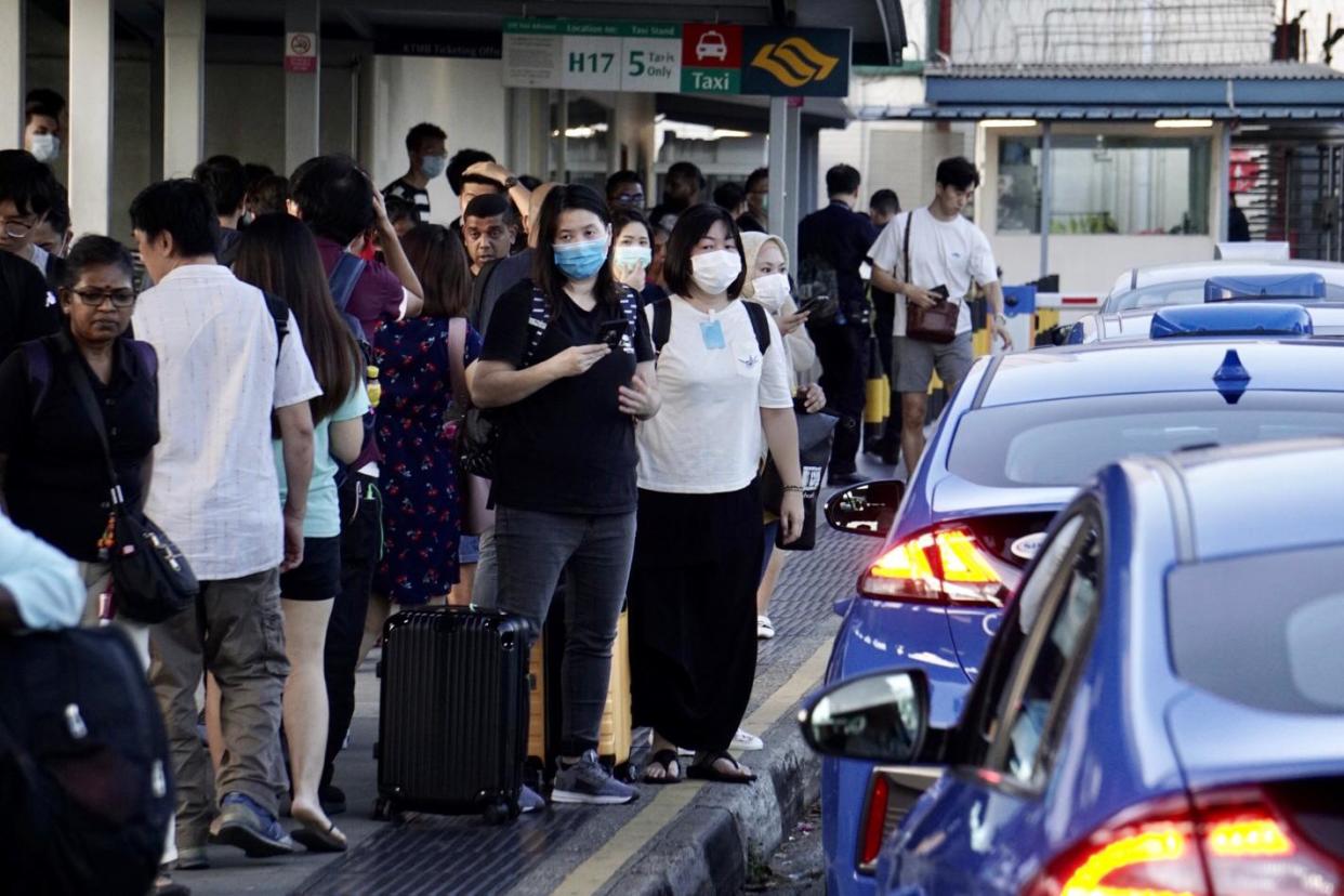 People arriving at Woodlands Checkpoint on 17 March, 2020. (PHOTO: Dhany Osman/Yahoo News Singapore)