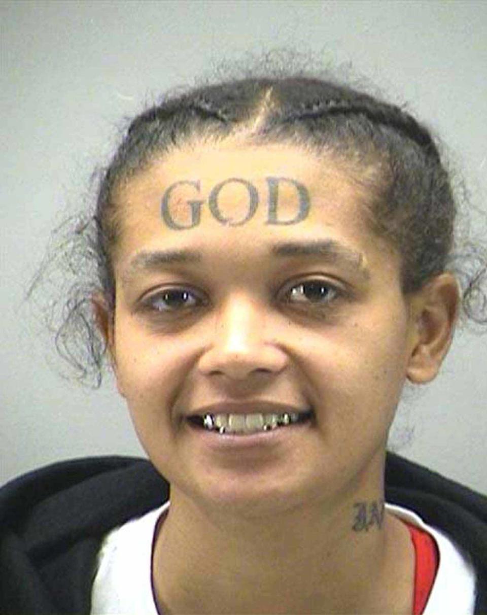 The girl with the God tattoo: Jamie Calloway was recently arrested in Montgomery County, Maryland, for stalking a female officer at her correctional facility. Calloway admires God so much that she even had the name inked above her brow for all to see. The convict has reportedly uploaded videos of her reading passages from the Bible on YouTube and even calls herself "Godologist of Godology."