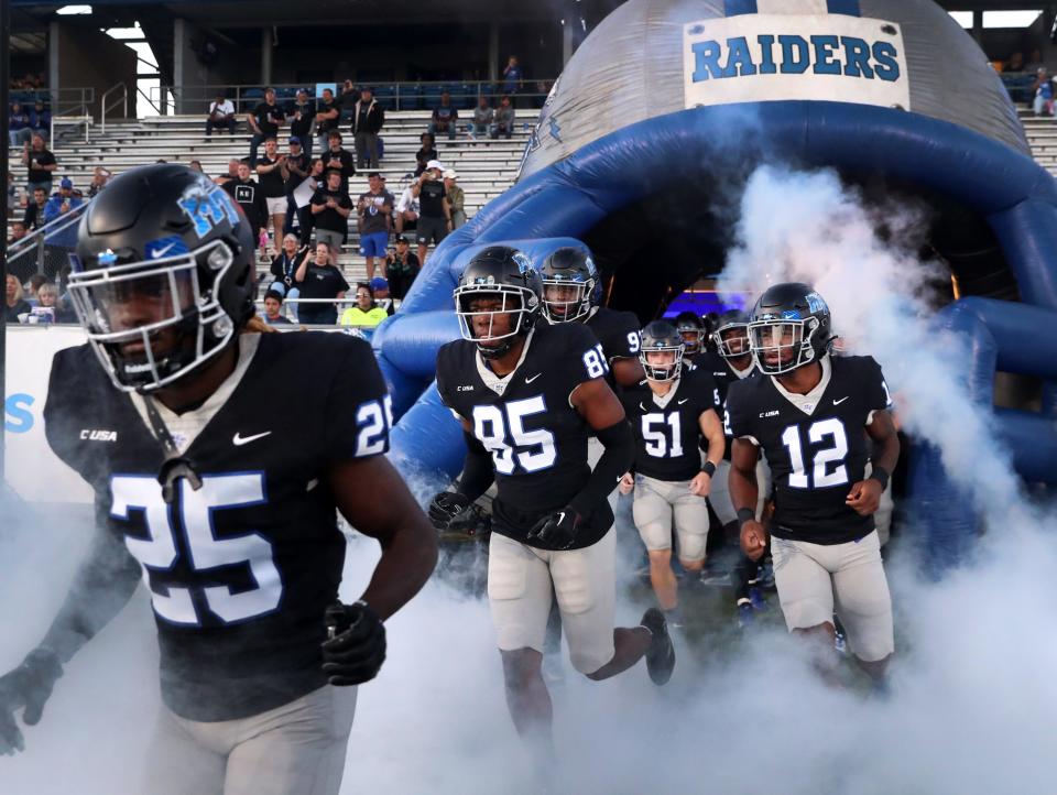 MTSU players run onto the field before the start of the game against UTSA on Friday, Sept. 30, 2022, in Floyd Stadium at MTSU.