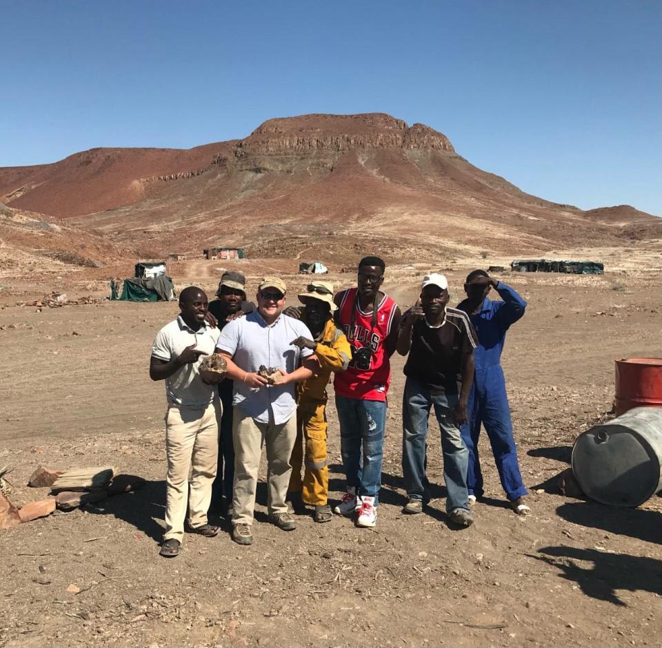 Alex Porada of Rough Stone.Rocks, third from left, pictured with local miners in the Goboboseb Mountains of Namibia.