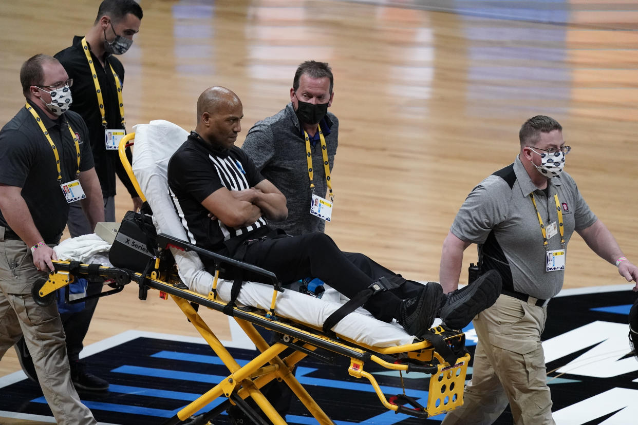 Bert Smith on a stretcher. 