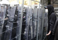 Serbian riot police officers guard the area during the European LGBTQ pride march in Belgrade, Serbia, Saturday, Sept. 17, 2022. Serbian police have banned Saturday's parade, citing a risk of clashes with far-right activists. (AP Photo/Vladimir Milovanovic)