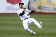 Oakland Athletics' Luis Barrera catches a ball hit by Minnesota Twins' Max Kepler during the second inning of a baseball game in Oakland, Calif., Tuesday, May 17, 2022. (AP Photo/Jed Jacobsohn)