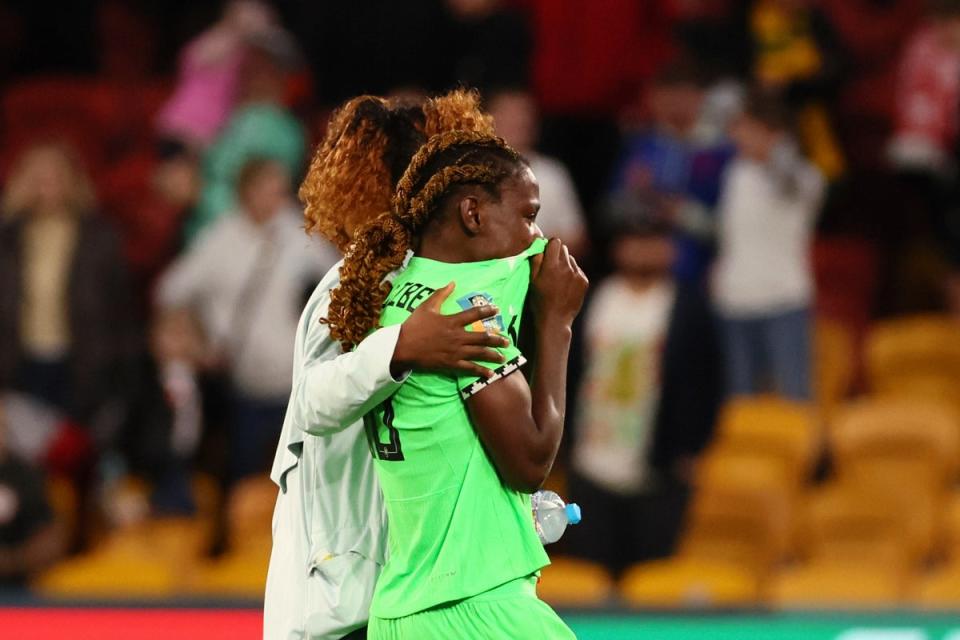 Christy Ucheibe leaves the pitch after Nigeria fail to beat England (AP)