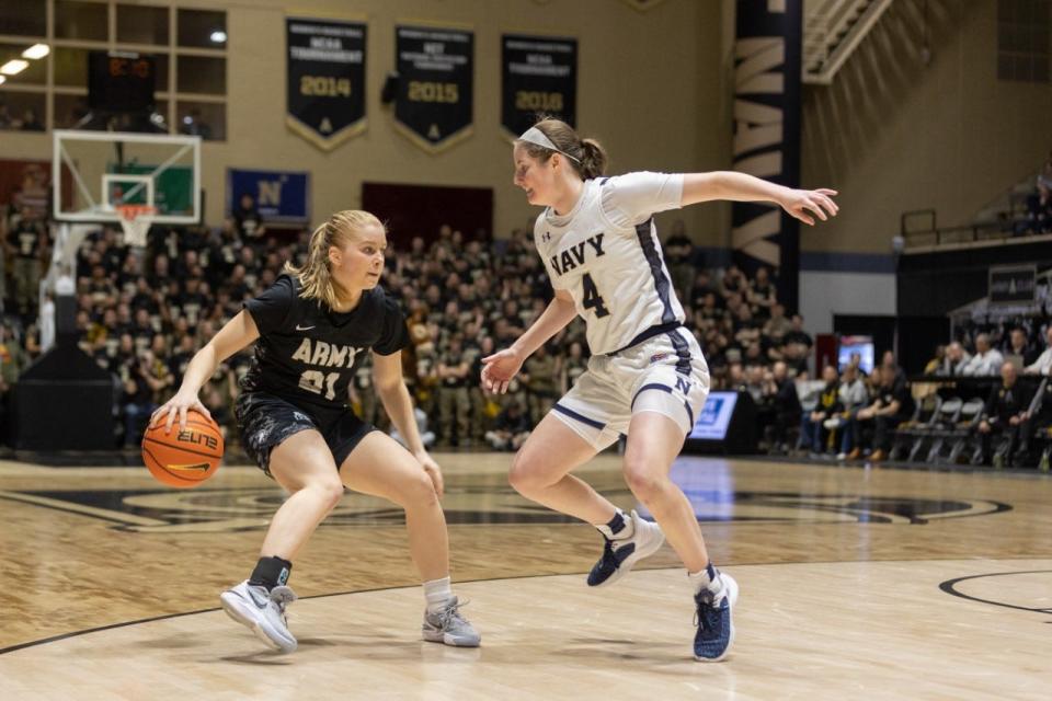Army freshman Reese Ericson, left, pulls up on her dribble against Navy on Saturday. ALLYSE PULLIAM/For the Times Herald-Record