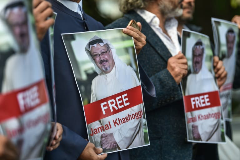 Protestors hold pictures of journalist Jamal Khashoggi during a demonstration in front of the Saudi Arabian consulate in Istanbul on October 5, 2018