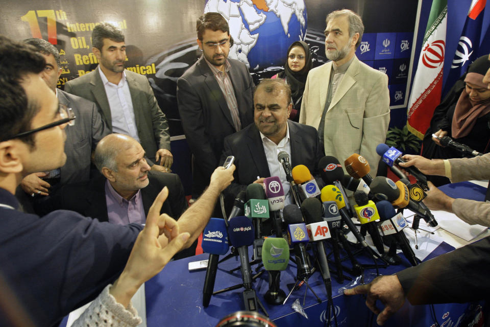 Iran's Oil Minister Rostam Ghasemi, seated at center, concludes his press conference, at the sideline of Iran's Oil Show, in Tehran, Iran, Thursday, April 19, 2012. Ghasemi on Thursday raised the prospect of more cutoffs in oil sales to the European Union if the bloc failed to show some flexibility toward Iran ahead of a second round of nuclear talks next month. (AP Photo/Vahid Salemi)