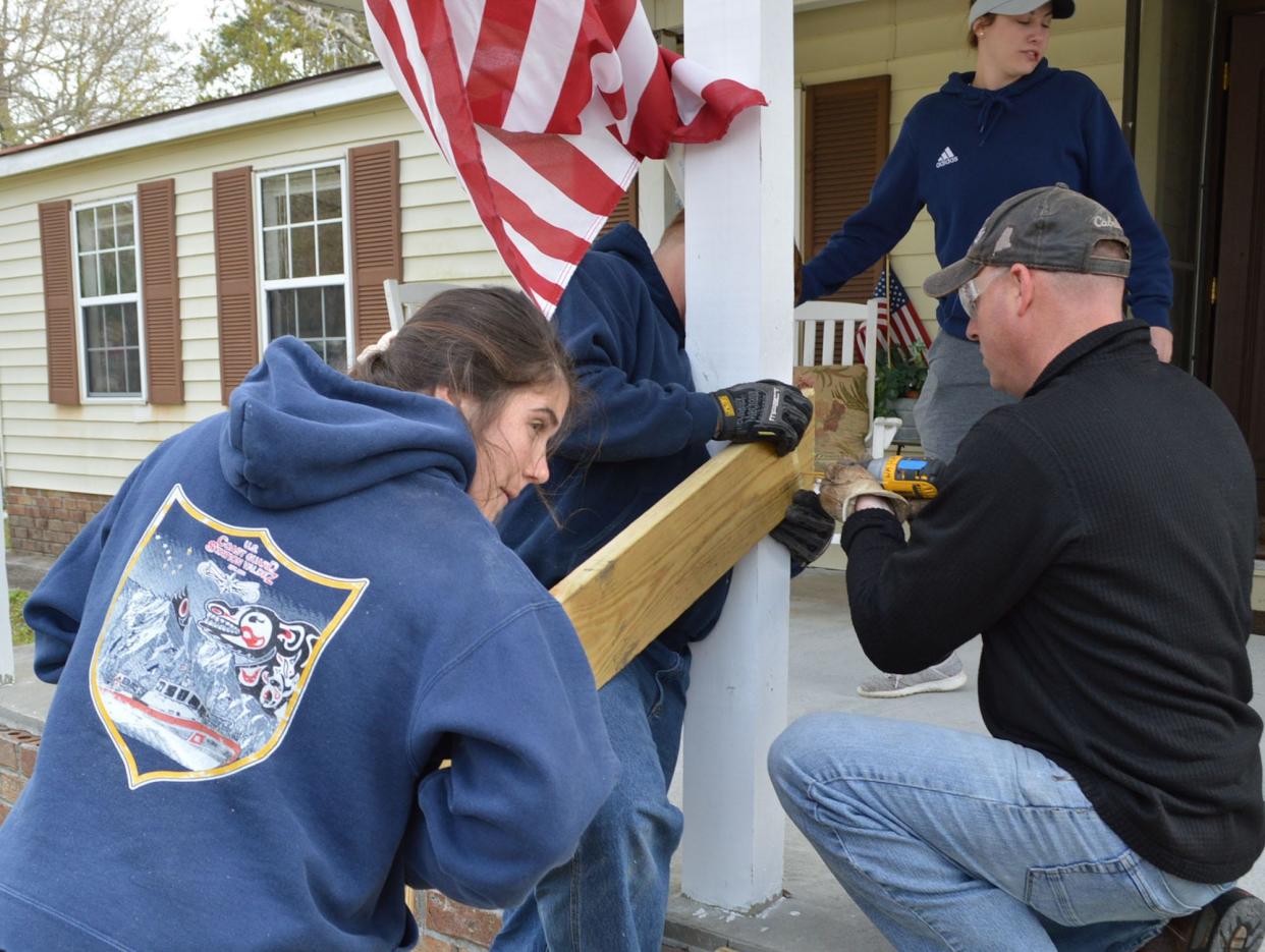 Members of the U.S. Coast Guard Station at Oak Island help with a Wilmington Area Rebuilding Ministry project on Martin Luther King Jr. Day in 2020.
