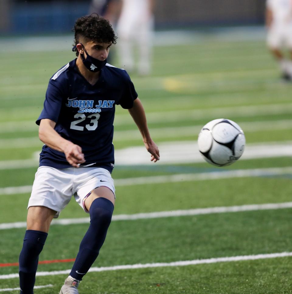 John Jay's Zach Rabadi keeps the ball under control while working through Mahopac's defense during Tuesday's game on October 13, 2020. 