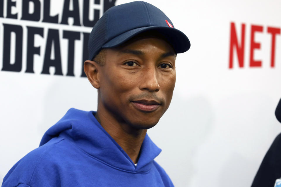 FILE - Pharrell Williams attends the world premiere of "The Black Godfather," in Los Angeles on June 3, 2019. Dozens of artists have objected to Donald Trump using their music in his two presidential campaigns. Williams sent a cease-and-desist letter after his song ”Happy" was played at a Trump rally in 2018. He was especially angered that the event was hours after a mass shooting at a Pittsburgh synagogue. (Photo by Mark Von Holden/Invision/AP, File)