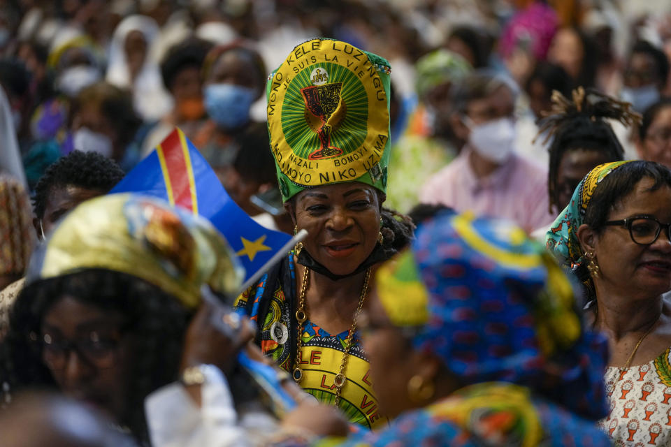 Faithful wait for the arrival of Pope Francis to celebrate a mass for the Congolese community, in St. Peter's Basilica at the Vatican, Sunday, July 3, 2022. (AP Photo/Andrew Medichini)