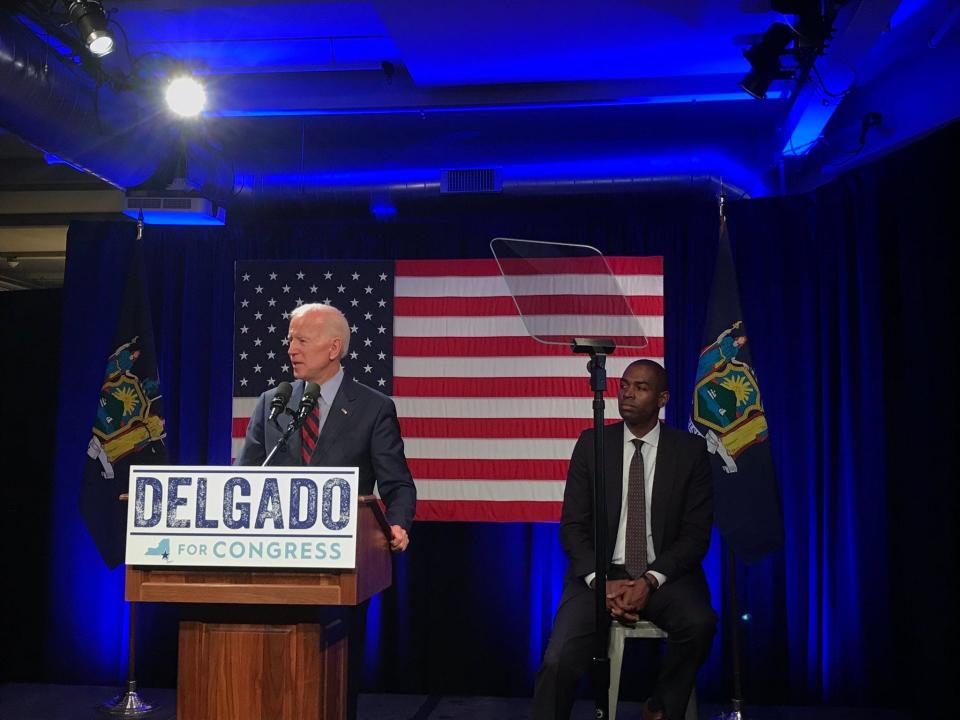 Joe Biden speaks as Antonio Delgado looks on at a 2018 campaign event.