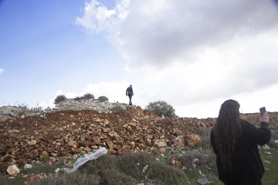 A European Union official visits a construction site for Givat Hamatos settlement in Jerusalem, Monday, Nov. 16, 2020. The Israel Land Authority announced on its website Sunday that it had opened up tenders for more than 1,200 new homes in the settlement of Givat Hamatos, according to the Israeli anti-settlement group Peace Now. (AP Photo/Maya Alleruzzo)