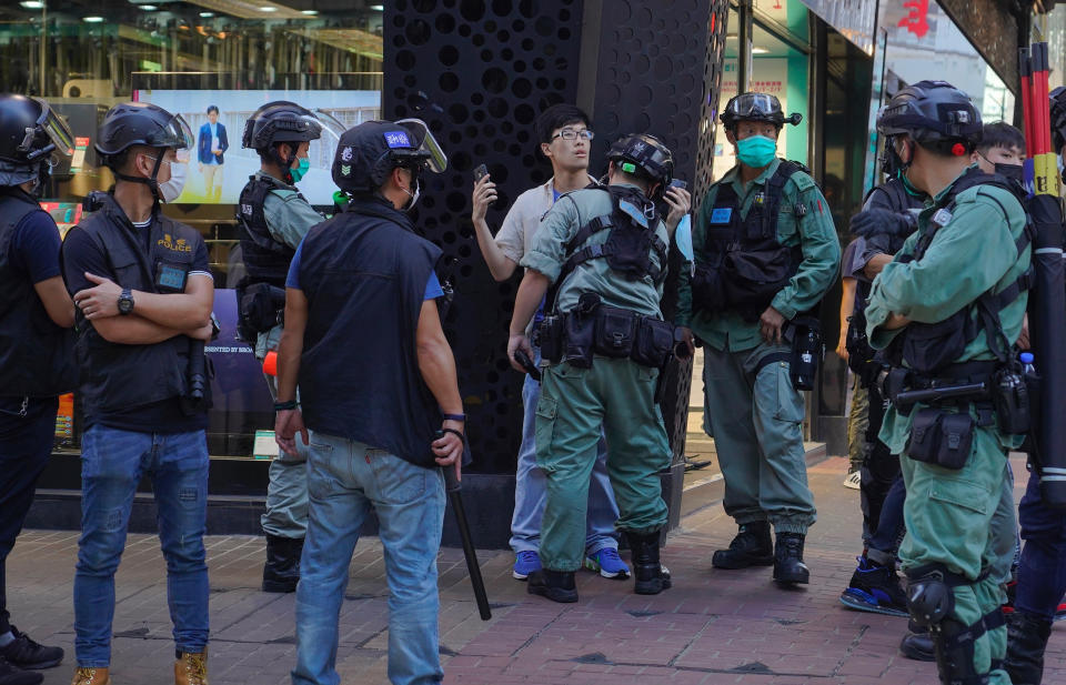 Police detain a person during a pro-democracy rally supporting human rights and to protest against Beijing's national security law in Hong Kong, Sunday, June 28, 2020. (AP Photo/Vincent Yu)